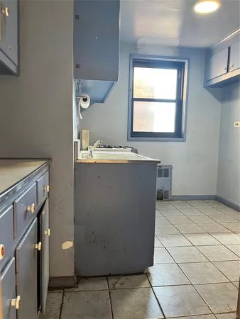 a kitchen with stainless steel appliances granite countertop a sink stove and a window