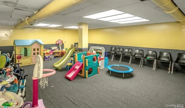 a view of living room with furniture and wooden floor