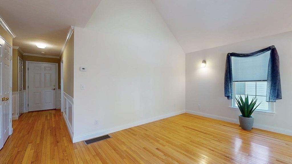 31 Enaya Circle, Unit 31 Worcester, MA 01606 - Photo 12 of 35 a view of a room with wooden floor and a potted plant