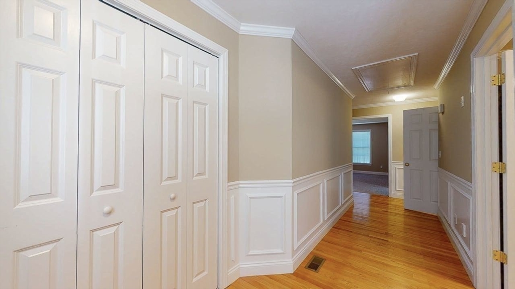 31 Enaya Circle, Unit 31 Worcester, MA 01606 - Photo 20 of 35 a view of a hallway with wooden floor and staircase