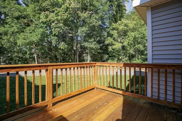 a view of balcony with wooden floor
