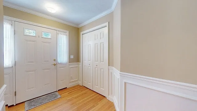 a view of hallway with wooden floor