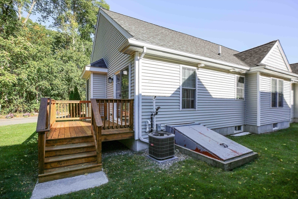 31 Enaya Circle, Unit 31 Worcester, MA 01606 - Photo 35 of 35 a view of a chairs setting in back yard of the house