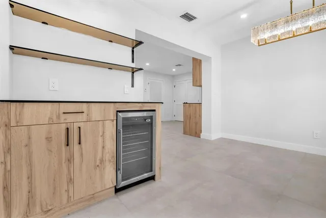 a view of a kitchen with a stove wooden floor kitchen and a window