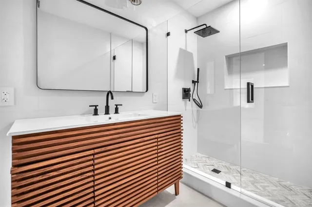 a view of kitchen with refrigerator and window