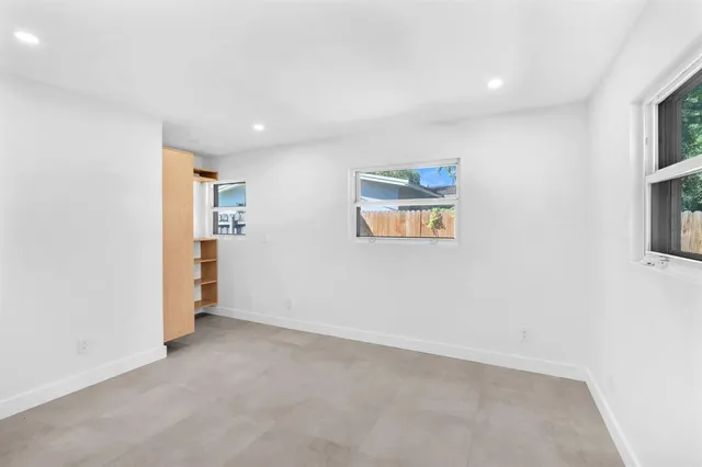 an empty room with windows