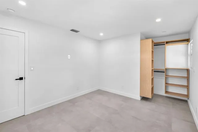 a view of wooden floor and windows in kitchen