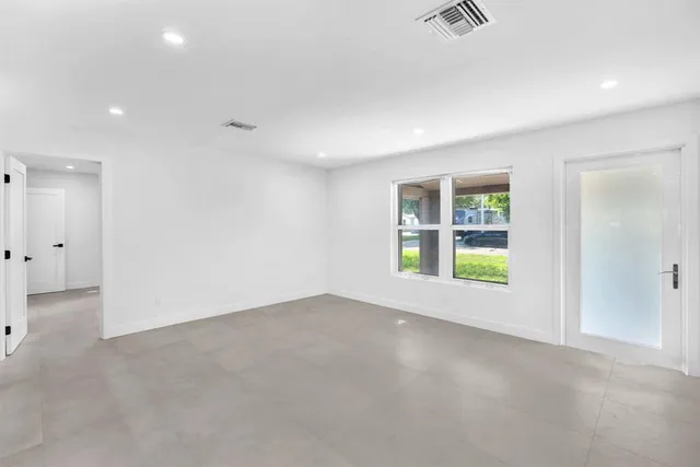 a view of a house with backyard and porch