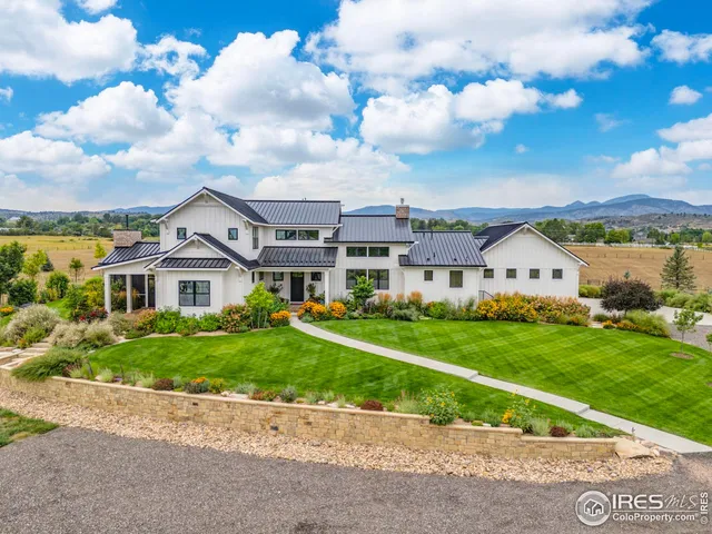 a view of house with yard and green space
