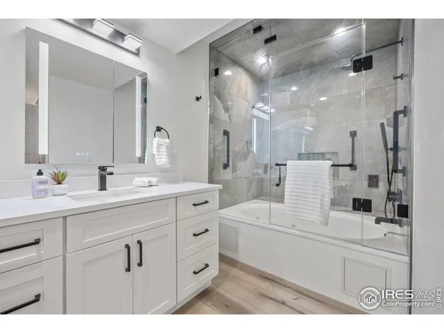a bathroom with a sink double vanity and a mirror