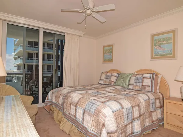 a bedroom with a bed and a closet with mirror