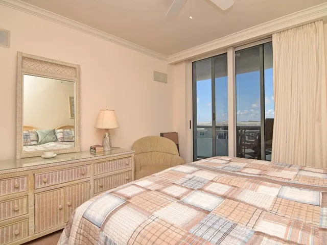 a bedroom with a bed and a closet with mirror