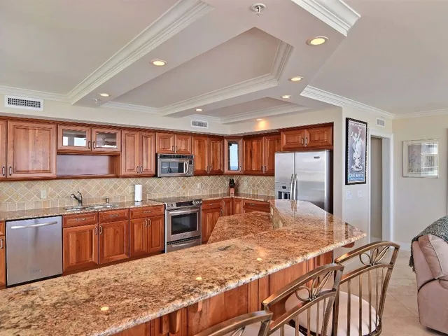 a kitchen with lots of counter top space and appliances