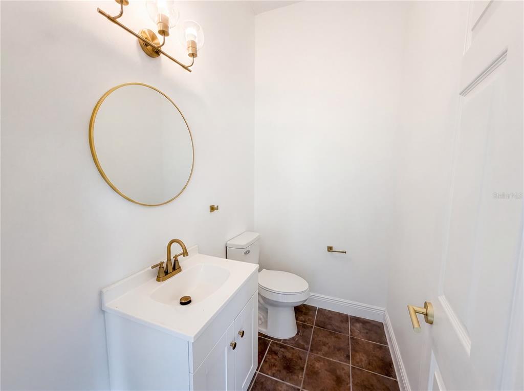 9405 Southwest 31st Lane Gainesville, FL 32608 - Photo 14 of 30 a bathroom with a sink mirror and toilet