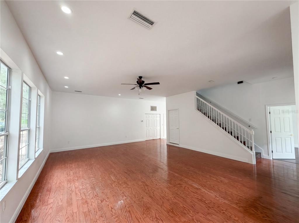 9405 Southwest 31st Lane Gainesville, FL 32608 - Photo 24 of 30 an empty room with wooden floor and windows