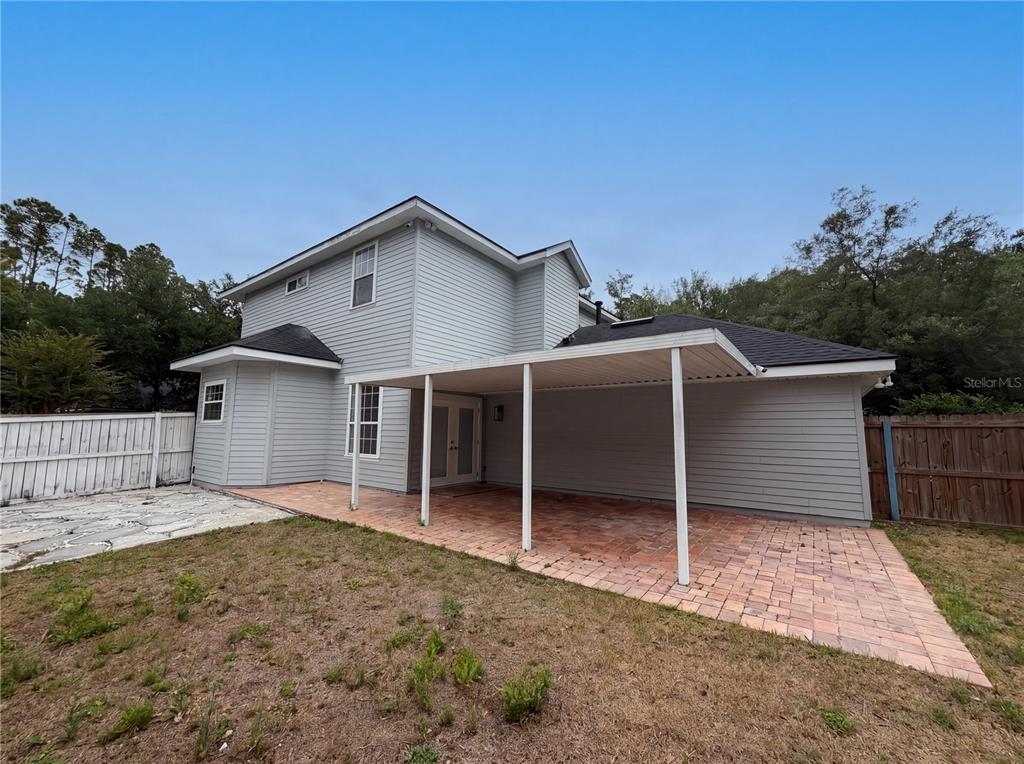 9405 Southwest 31st Lane Gainesville, FL 32608 - Photo 29 of 30 a house with trees in the background