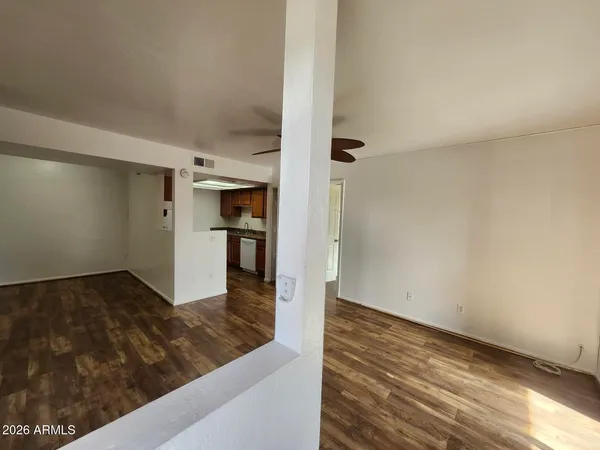 a view of a kitchen cabinets and wooden floor