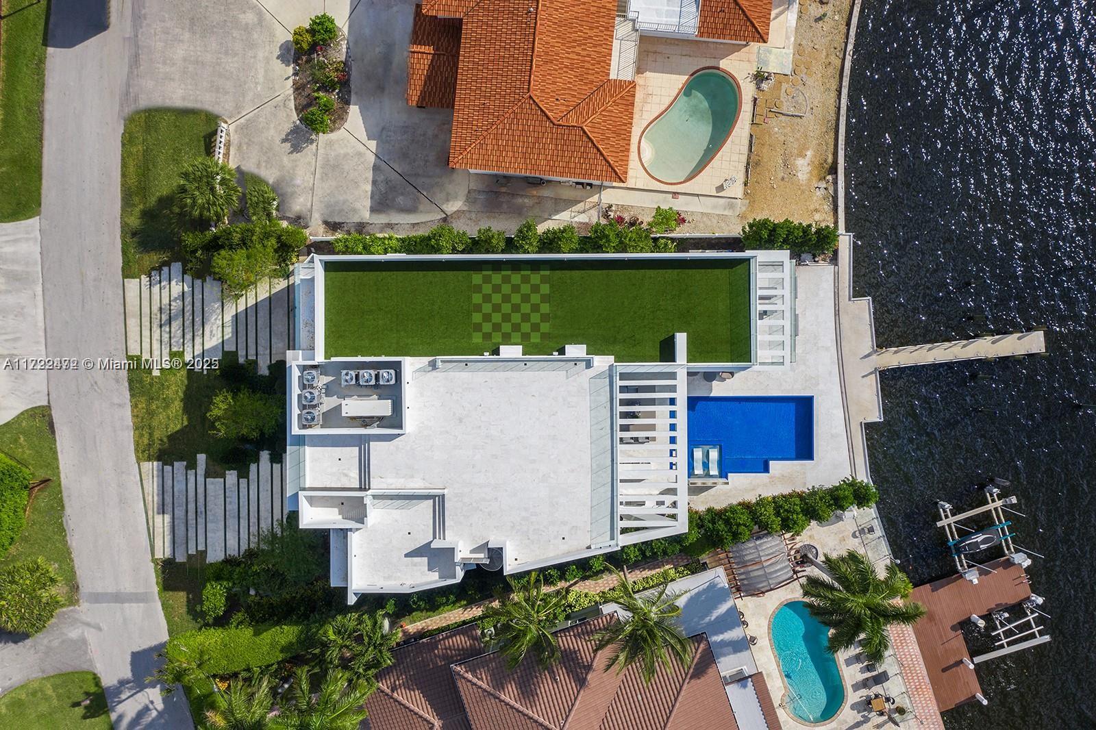 18530 North Bay Road Sunny Isles Beach, FL 33160 - Photo 8 of 10 an aerial view of a house with outdoor space