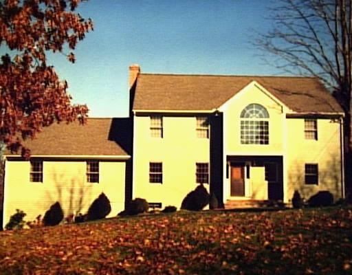84 Currituck Road Newtown, CT 06470 - Photo 1 of 1 a view of a large building with large windows