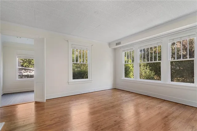 a kitchen with refrigerator and microwave