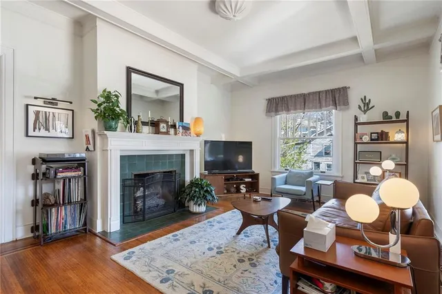 a living room with furniture and a fireplace