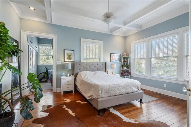 a bathroom with a toilet a sink a vanity and mirror