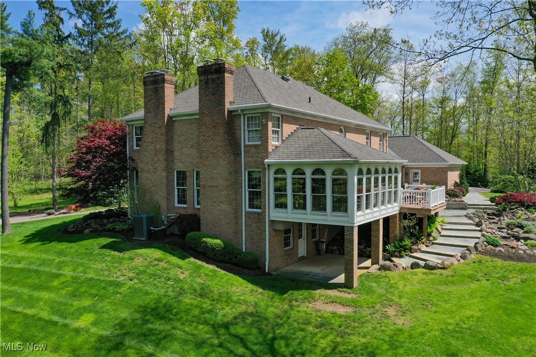 4432 Ira Road Akron, OH 44333 - Photo 42 of 50 Back of property featuring a chimney, brick siding, and stairs
