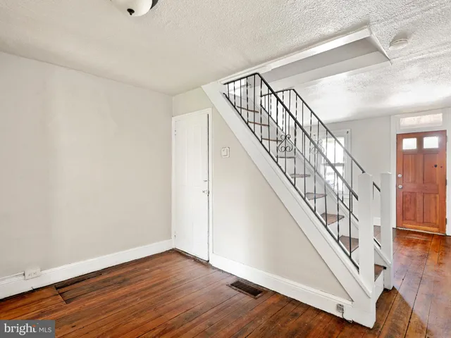 a view of entryway with wooden floor