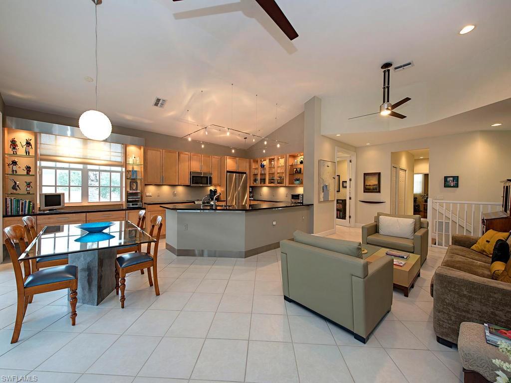 7120 Timberland Circle, Unit 202 Naples, FL 34109 - Photo 2 of 12 a living room with furniture and kitchen view