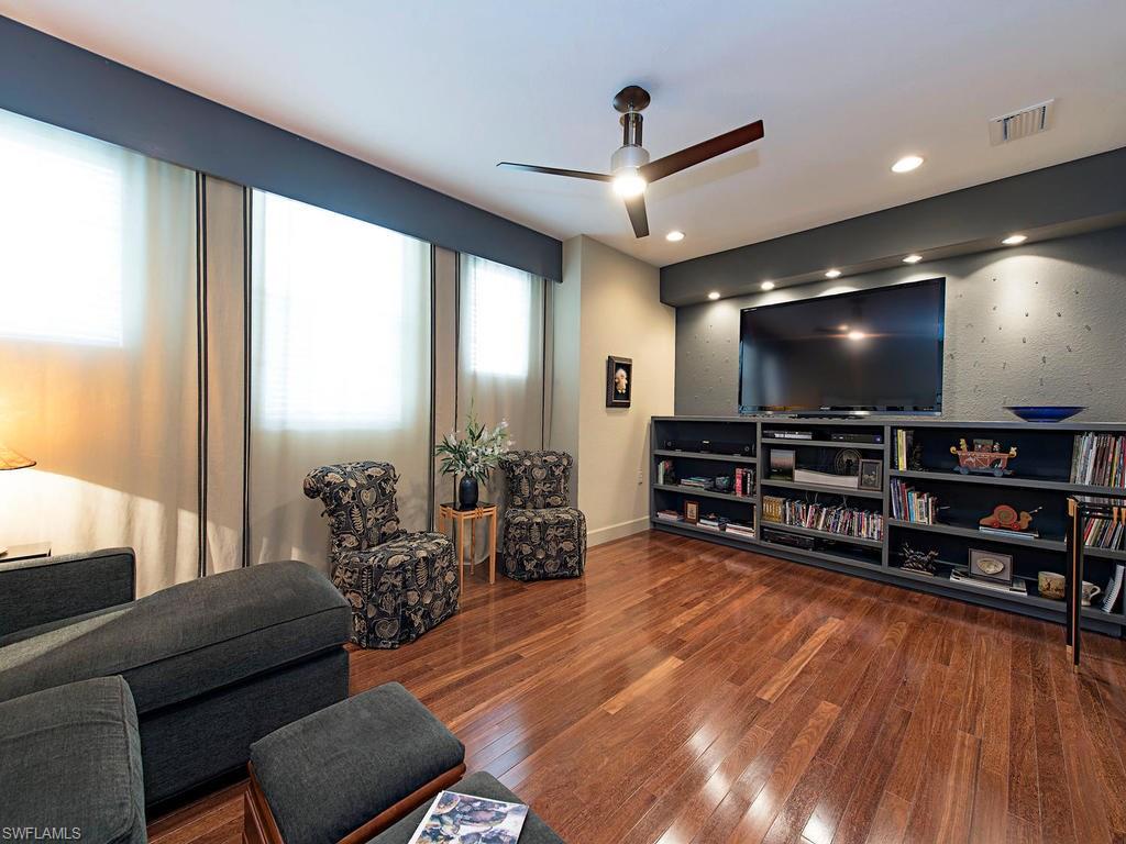 7120 Timberland Circle, Unit 202 Naples, FL 34109 - Photo 6 of 12 a living room with furniture a wooden floor and next to a window