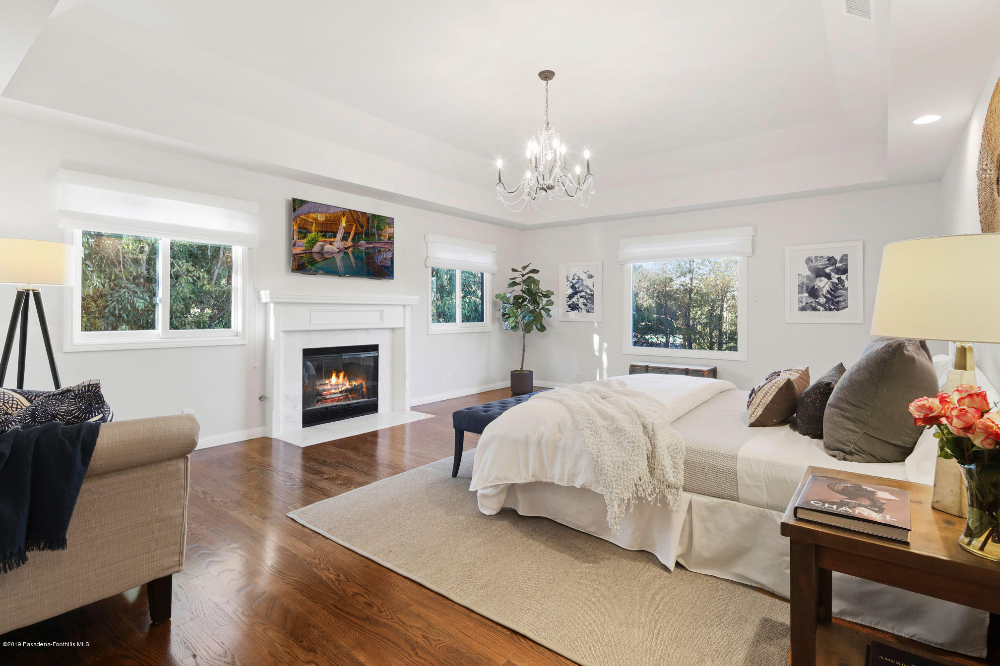 45 Club Road Pasadena, CA 91105 - Photo 18 of 36 a spacious bedroom with a bed and a fireplace
