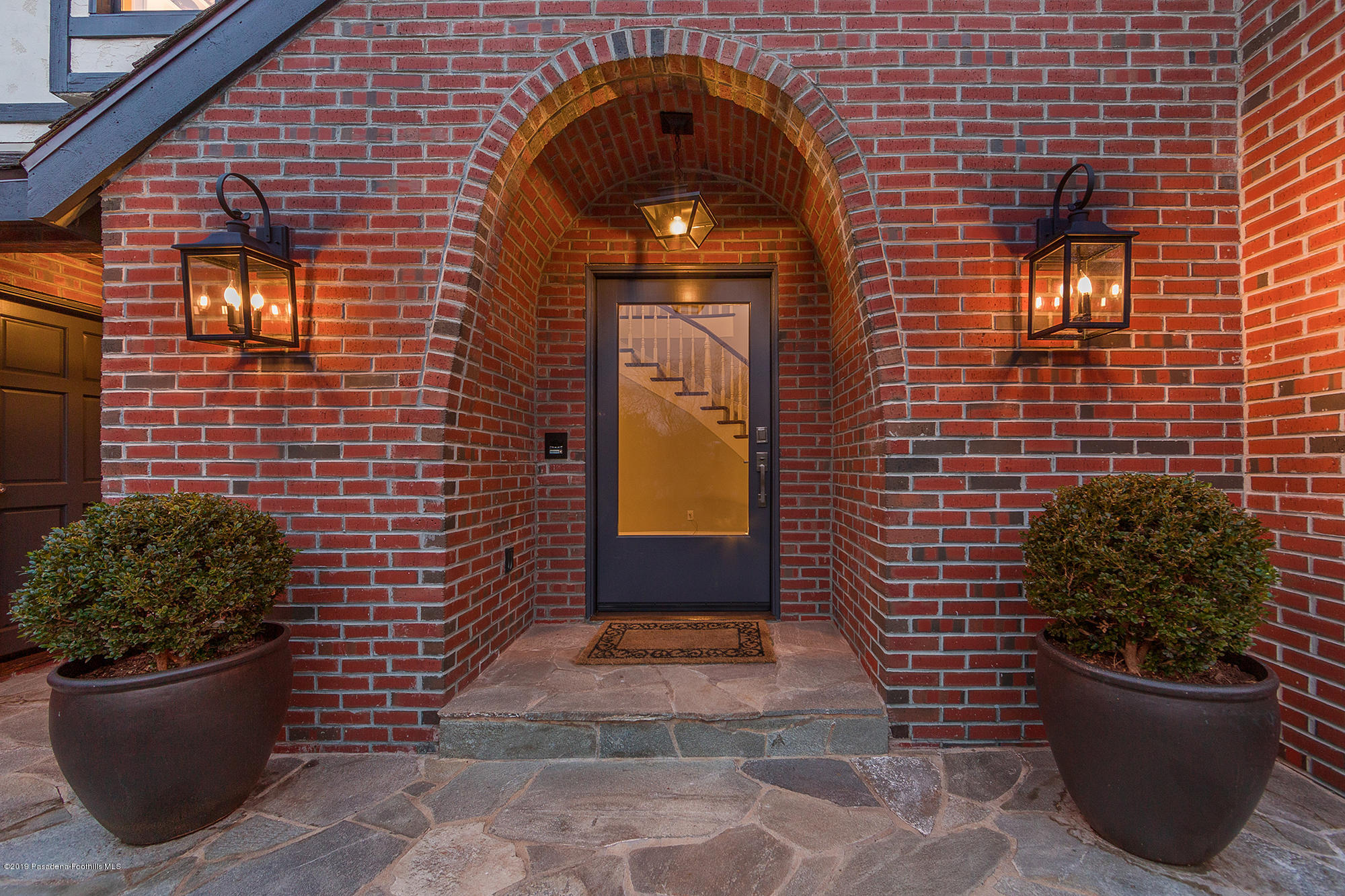45 Club Road Pasadena, CA 91105 - Photo 3 of 36 a view of a door of the house with potted plants