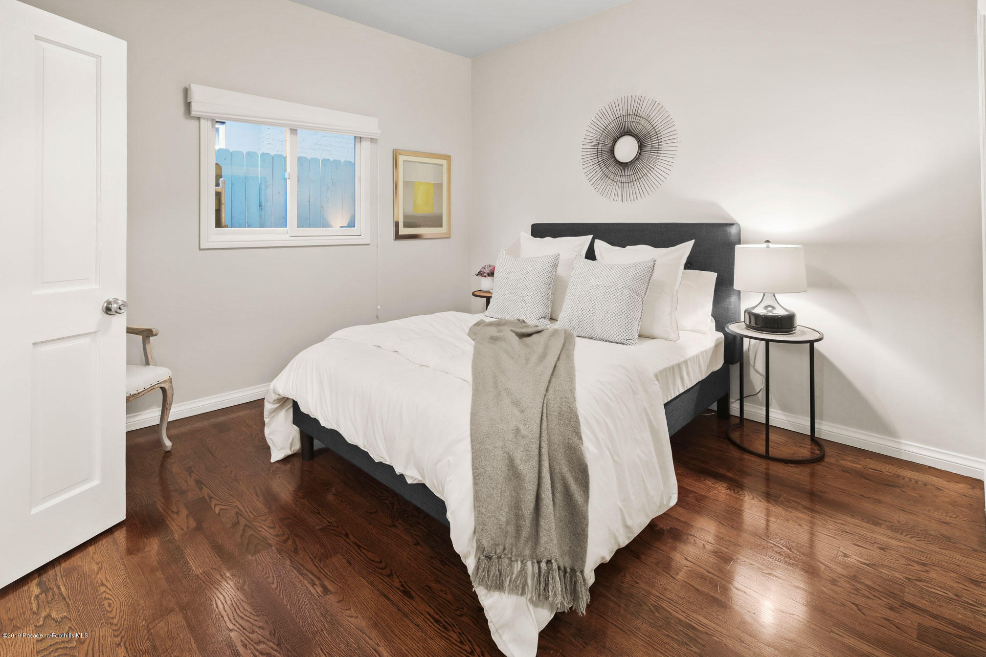 45 Club Road Pasadena, CA 91105 - Photo 28 of 36 a large bed sitting in a bedroom next to a lamp