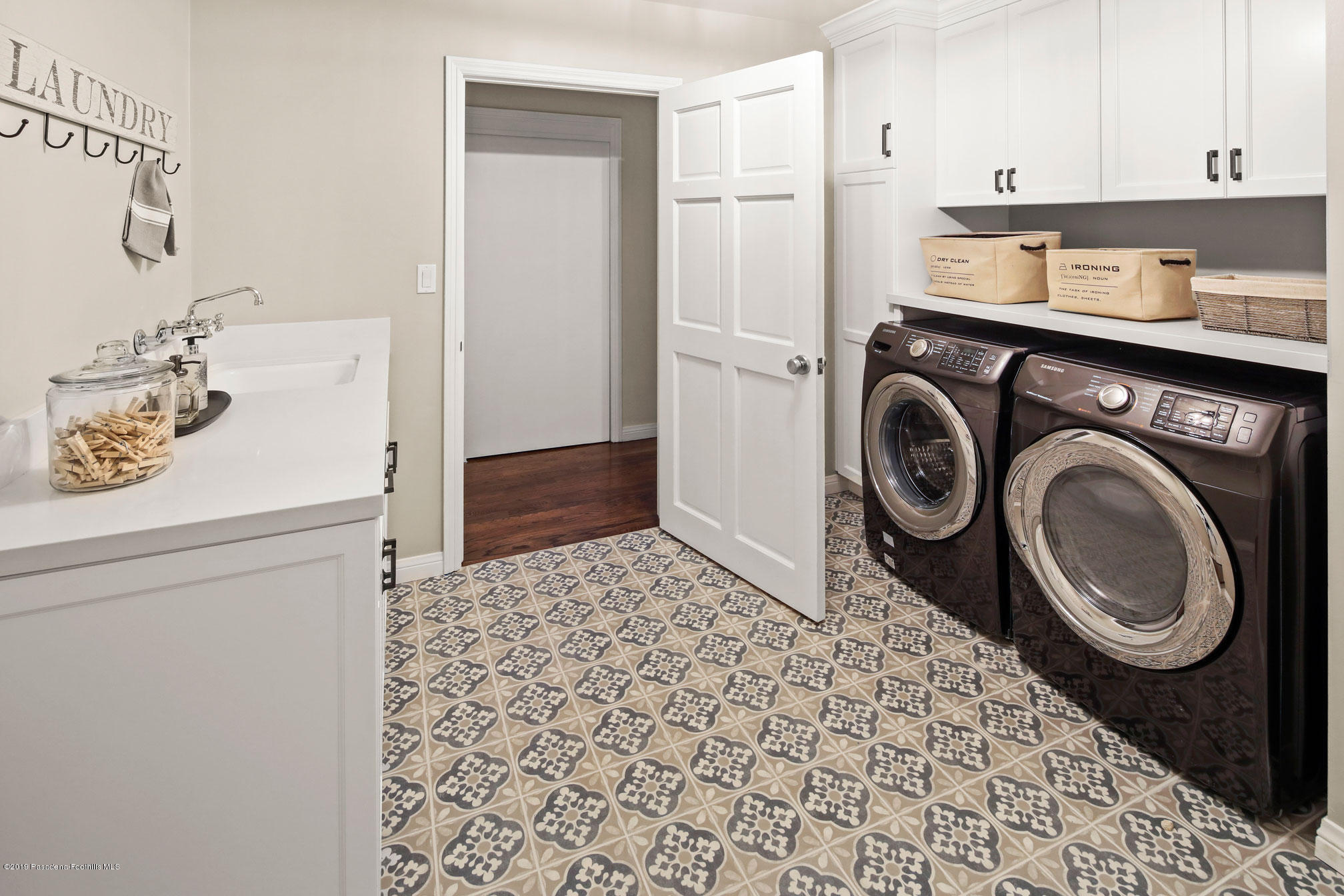45 Club Road Pasadena, CA 91105 - Photo 30 of 36 a bathroom with a sink and a washing machine