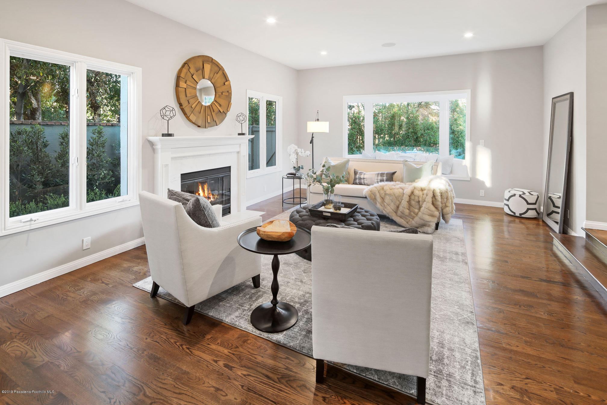 45 Club Road Pasadena, CA 91105 - Photo 7 of 36 a living room with furniture a large window and a fireplace