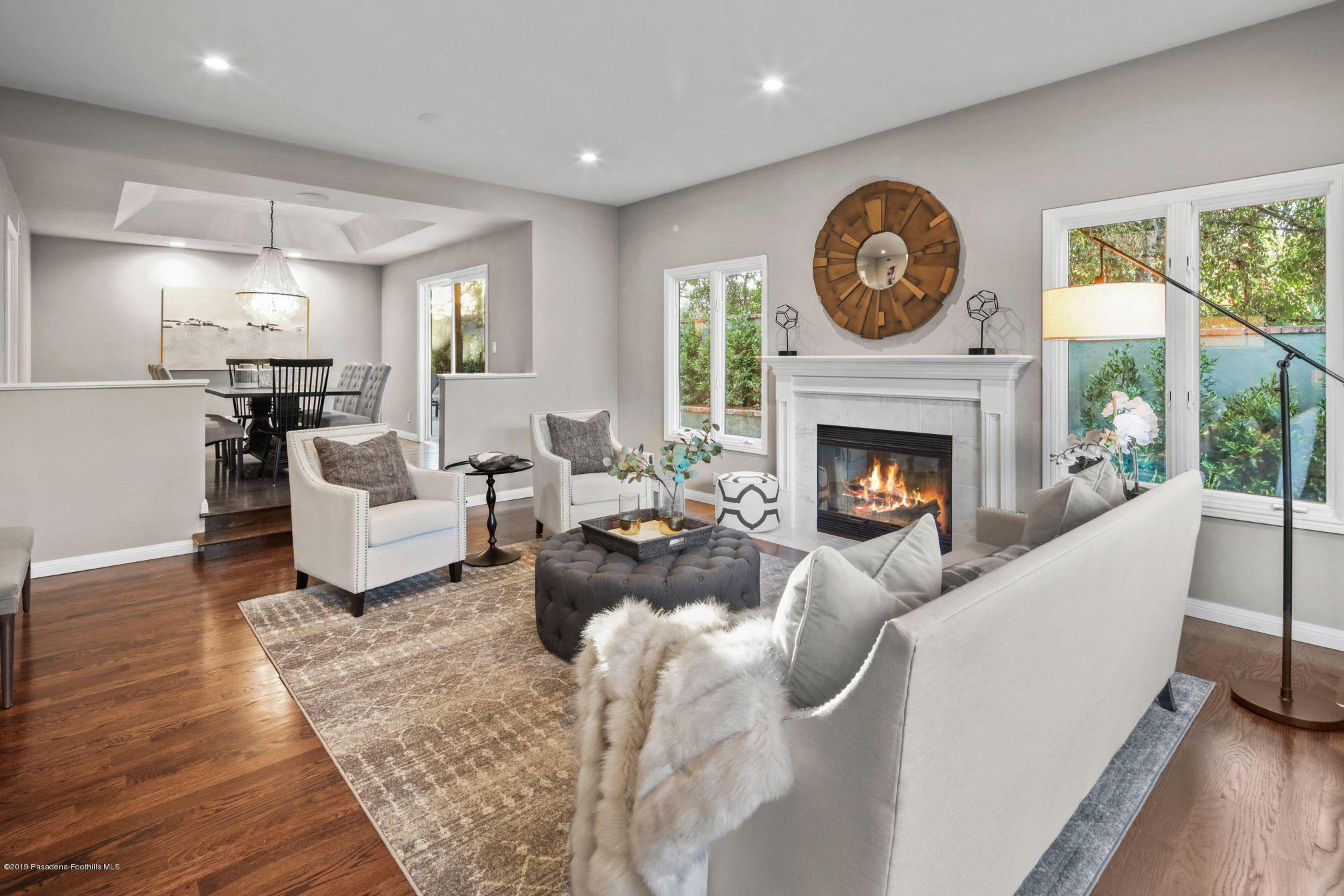 45 Club Road Pasadena, CA 91105 - Photo 8 of 36 a living room with furniture a clock and a fireplace