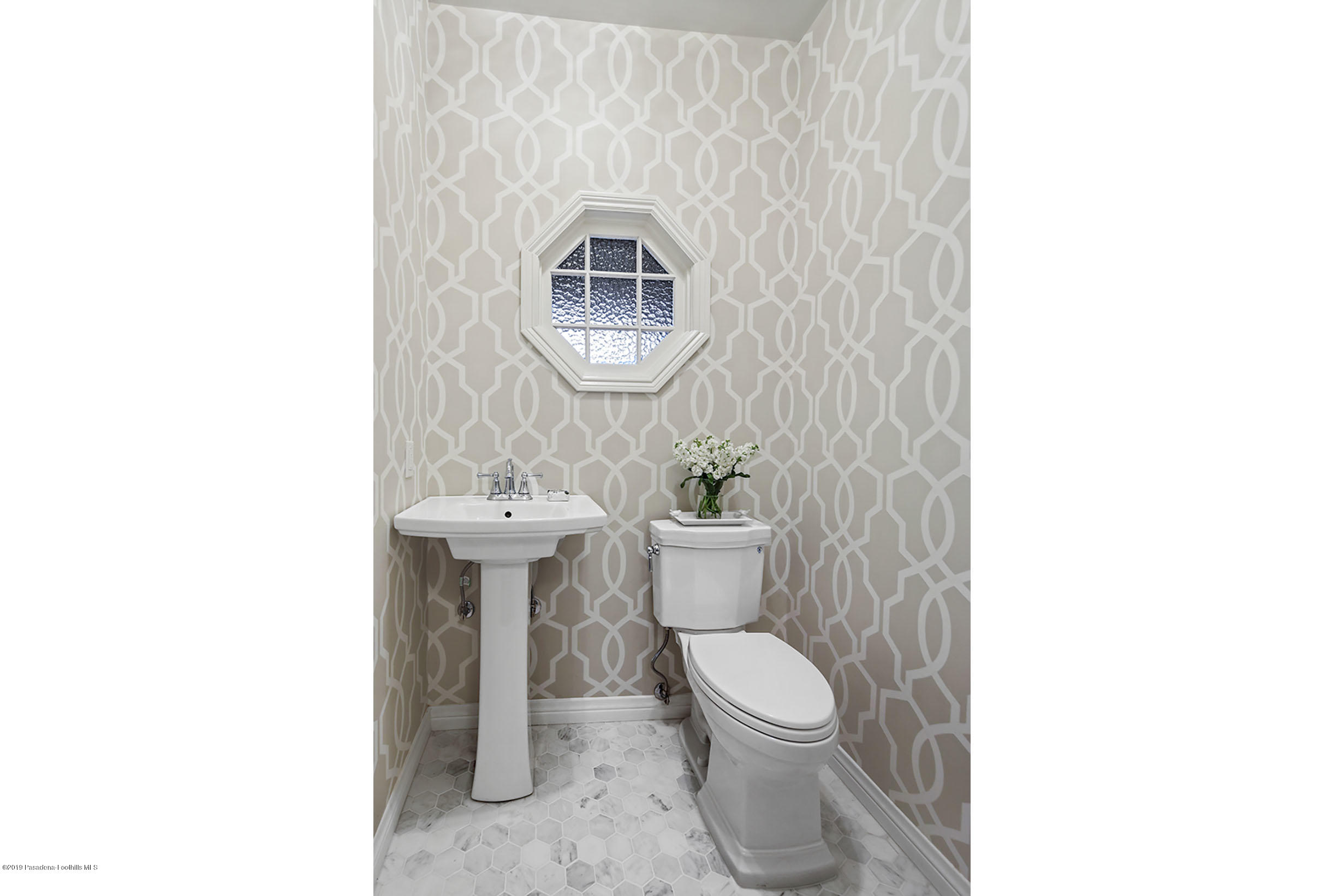 45 Club Road Pasadena, CA 91105 - Photo 10 of 36 a bathroom with a toilet sink and mirror