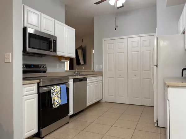 a view of a dining room with furniture and window