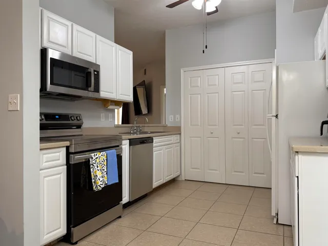 a view of a dining room with furniture and window