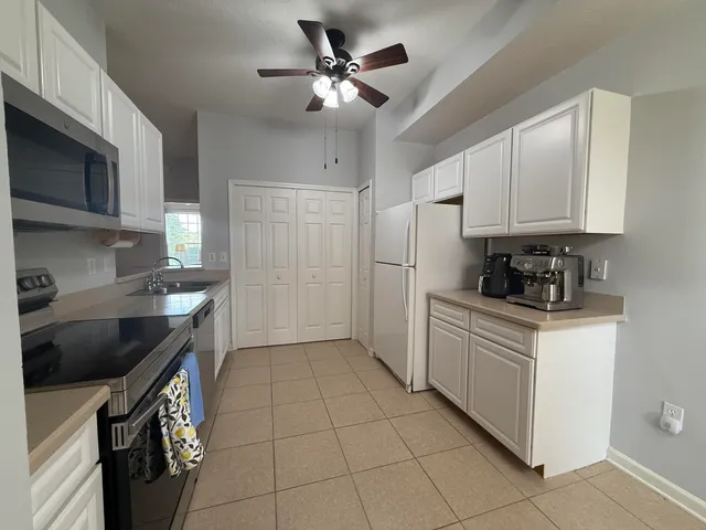 a bathroom with a sink mirror vanity and toilet
