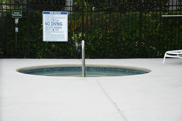 a yellow and white house with a yard in front of it