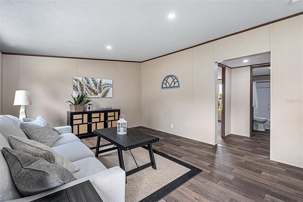 8150 Cherokee Road Bartow, FL 33830 - Photo 21 of 35 a living room with furniture and wooden floor