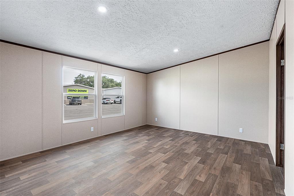 8150 Cherokee Road Bartow, FL 33830 - Photo 23 of 35 wooden floor in an empty room with a window