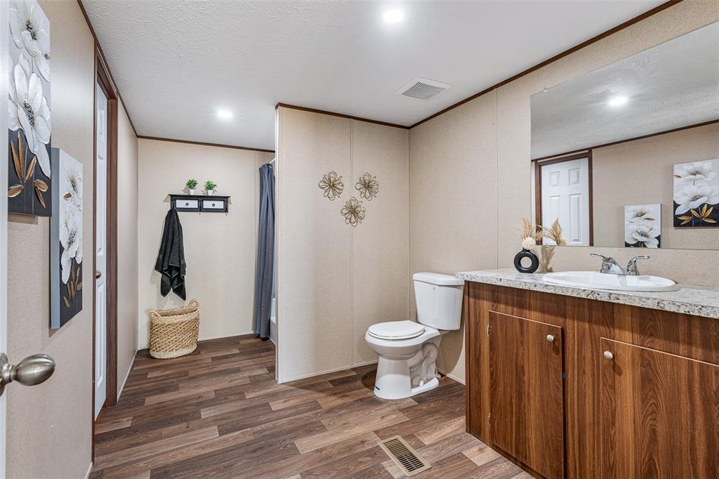 8150 Cherokee Road Bartow, FL 33830 - Photo 24 of 35 a bathroom with a sink toilet and shower