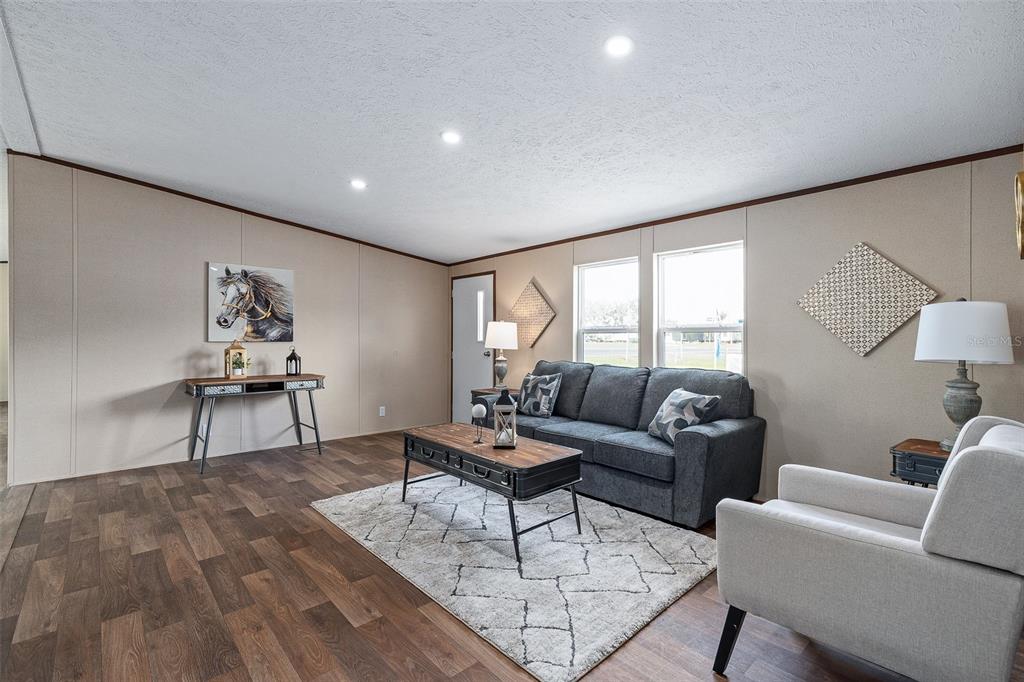 8150 Cherokee Road Bartow, FL 33830 - Photo 3 of 35 a living room with furniture and wooden floor