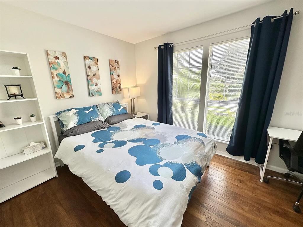 5164 Southwest 82 Terrace Gainesville, FL 32608 - Photo 13 of 25 a bedroom with a bed and a dresser next to a window