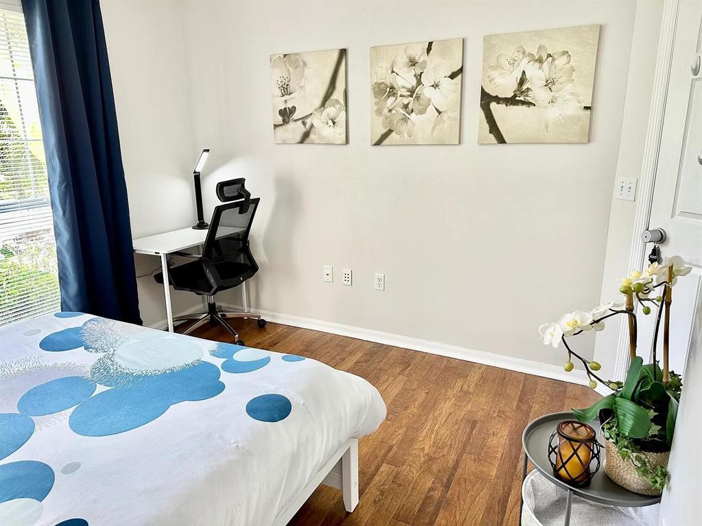 5164 Southwest 82 Terrace Gainesville, FL 32608 - Photo 14 of 25 a view of a dining room with furniture and wooden floor