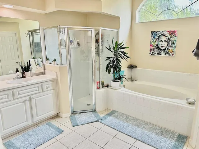 a bathroom with a bathtub and a sink