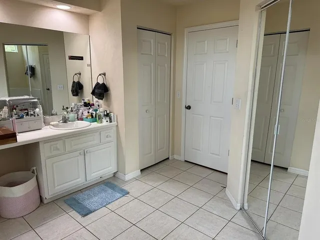 a bathroom with a sink toilet and mirror