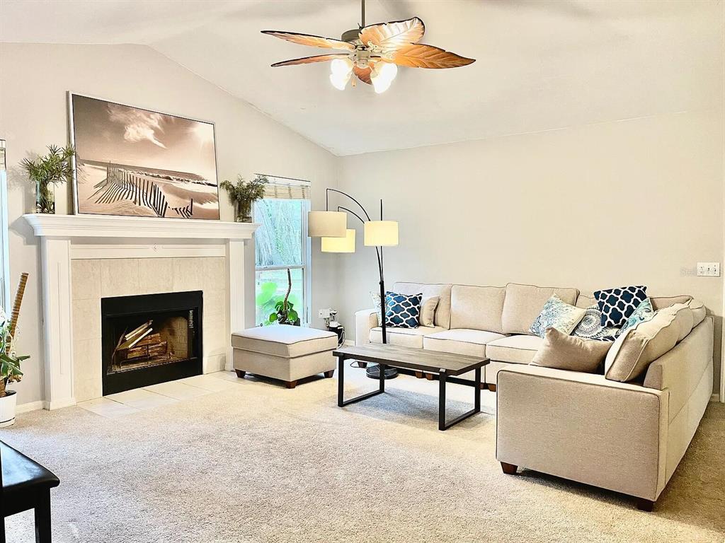 5164 Southwest 82 Terrace Gainesville, FL 32608 - Photo 9 of 25 a living room with furniture and a fireplace